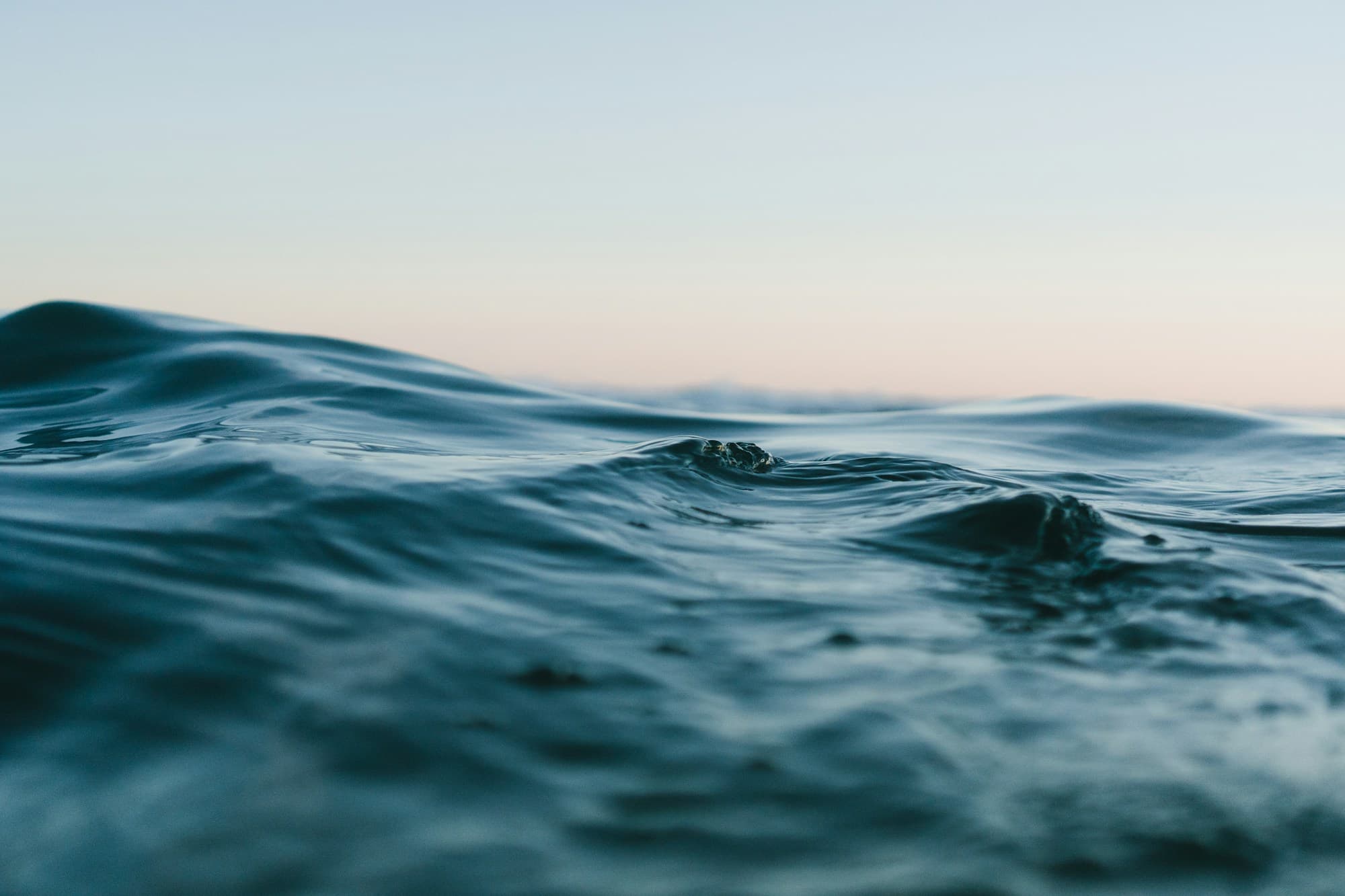 Open sea and sky, long horizon and calm light.